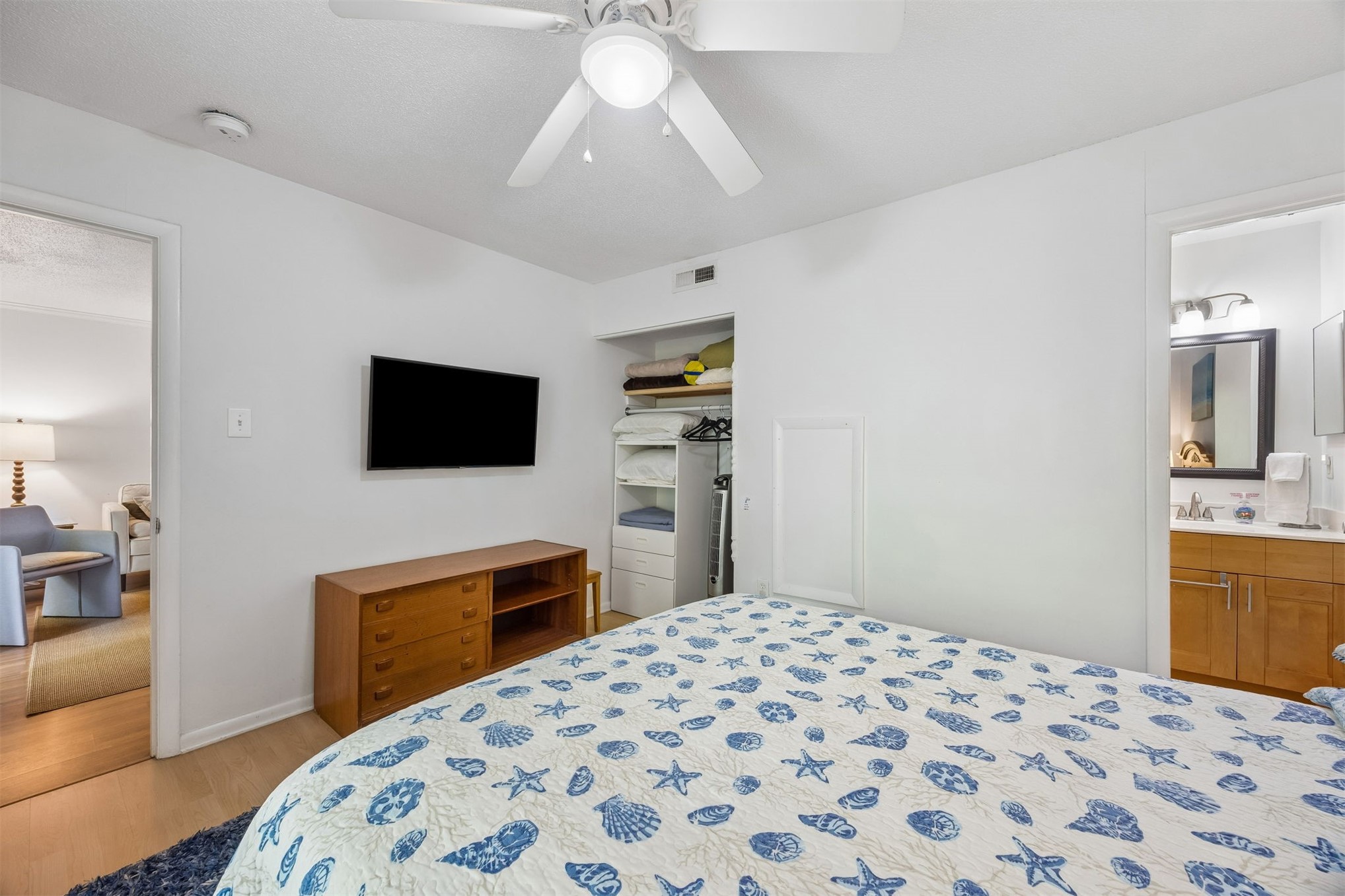 2328 Sadler Road, Unit 1C Fernandina Beach, FL 32034 - Photo 20 of 49 a bedroom with a bed and a flat screen tv