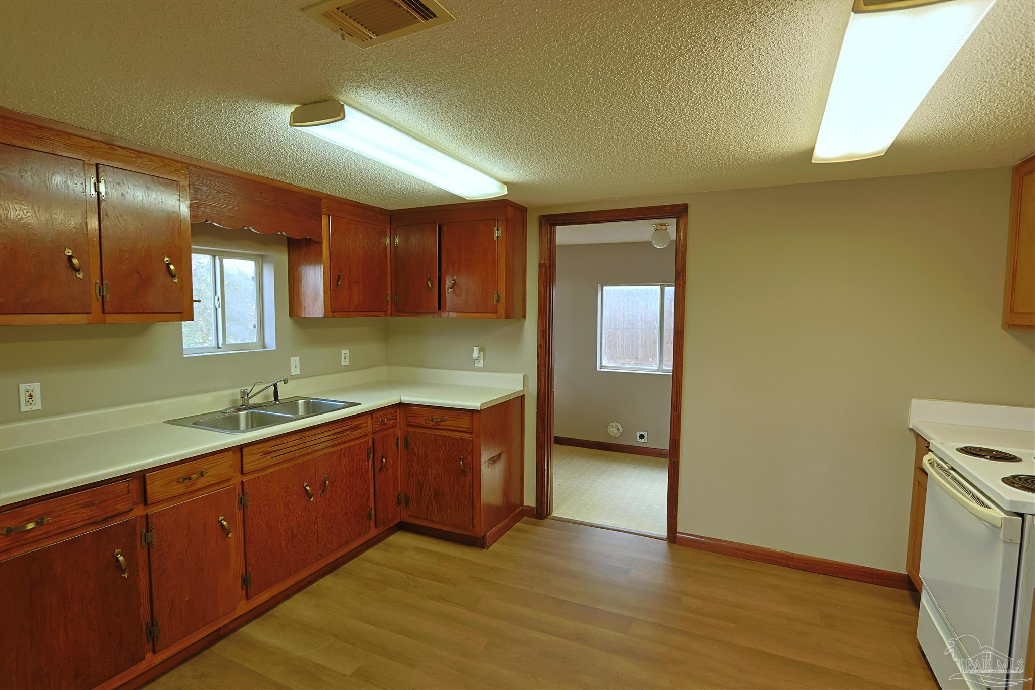 6941 Camp Henderson Road Jay, FL 32565 - Photo 5 of 17 a kitchen with sink and cabinets