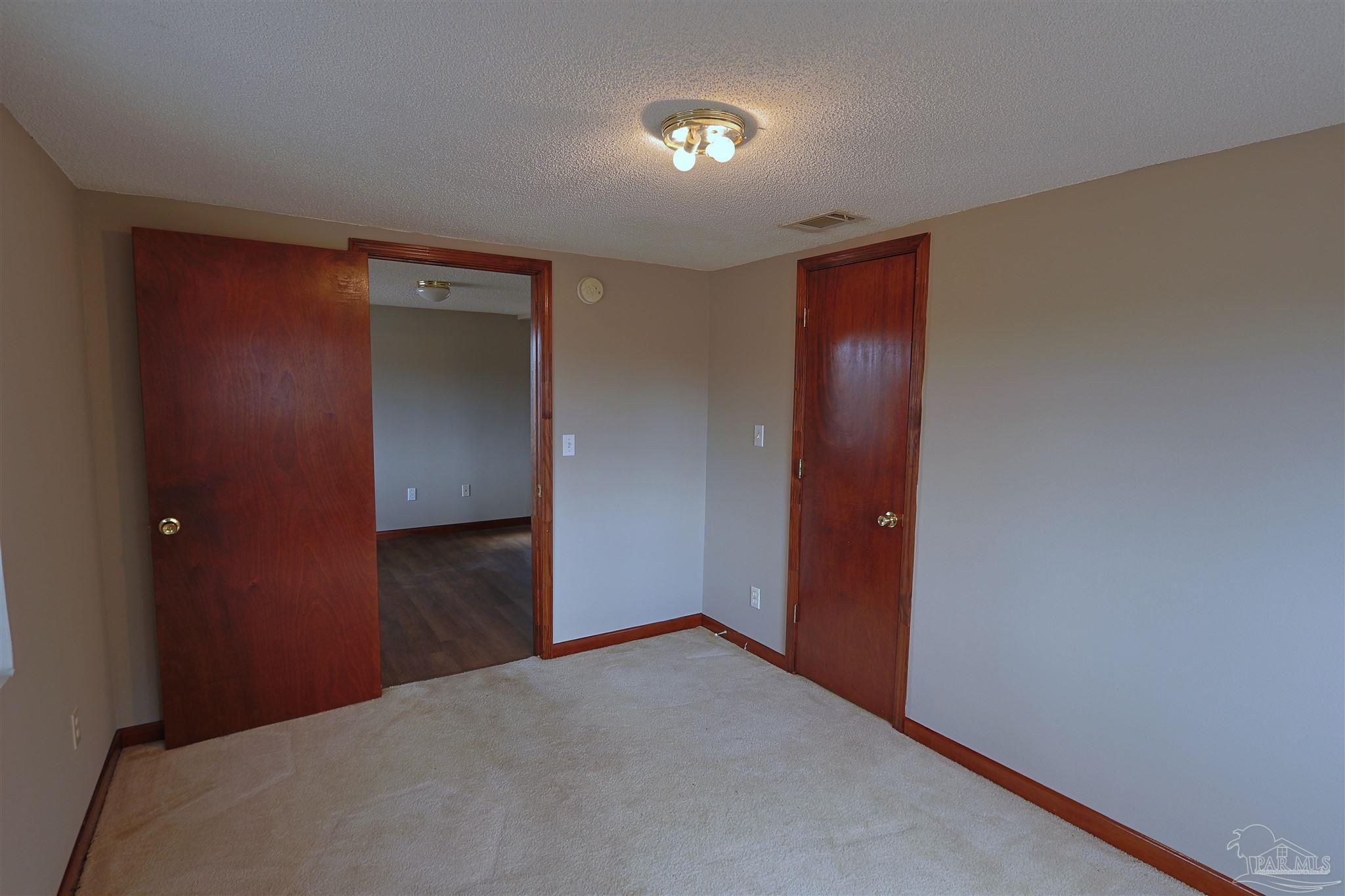 6941 Camp Henderson Road Jay, FL 32565 - Photo 10 of 17 a view of an empty room and closet area