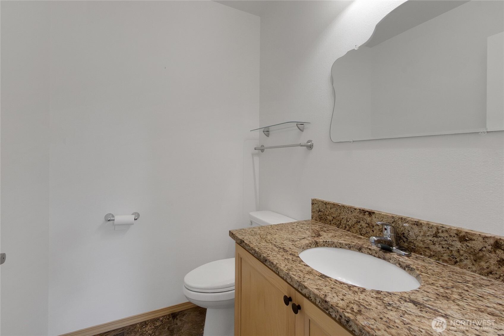 1450 Southeast Spruce Road Port Orchard, WA 98367 - Photo 29 of 39 a bathroom with a granite countertop sink a toilet and a mirror