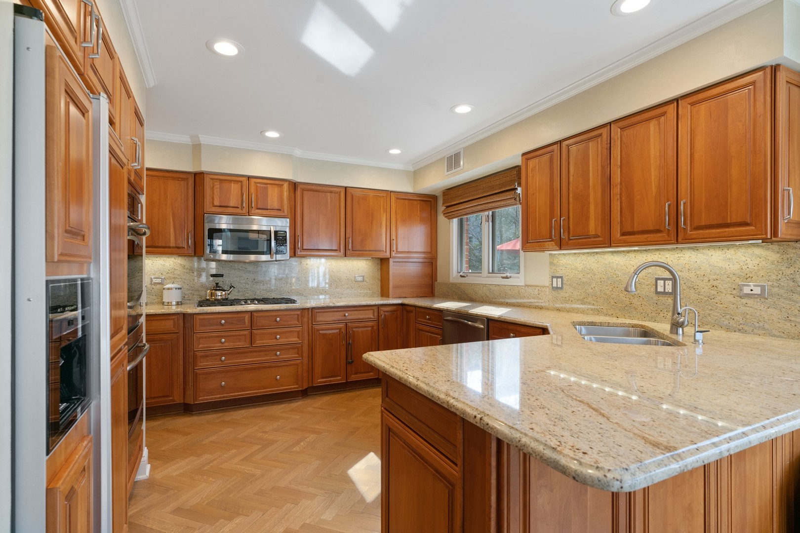 280 Sylvan Road Glencoe, IL 60022 - Photo 9 of 45 a kitchen with stainless steel appliances granite countertop a sink a stove and a refrigerator