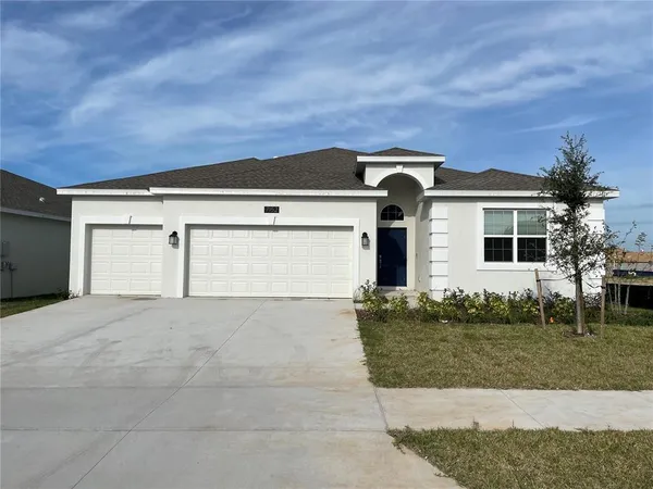 front view of a house with a yard