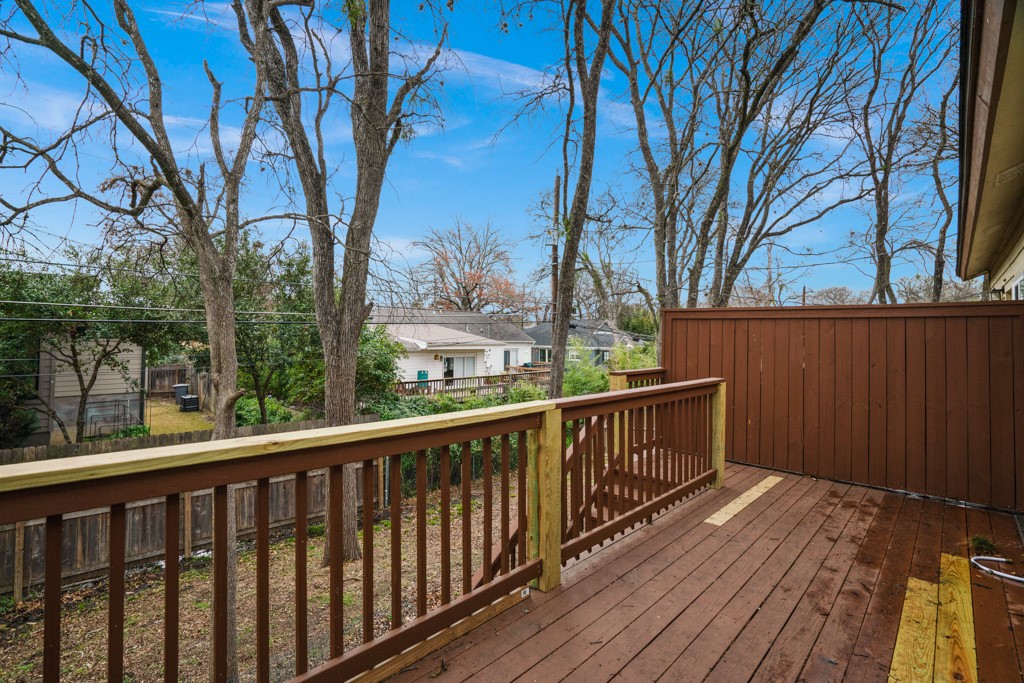 2208 Indian Trail, Unit A Austin, TX 78703 - Photo 19 of 21 a view of a wooden deck with trees