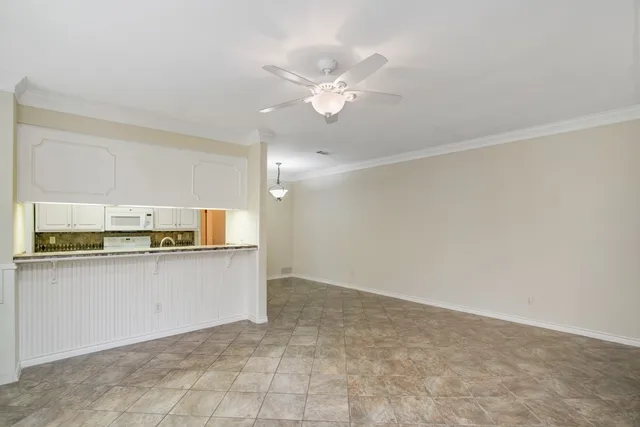 a view of a kitchen with a sink and cabinet