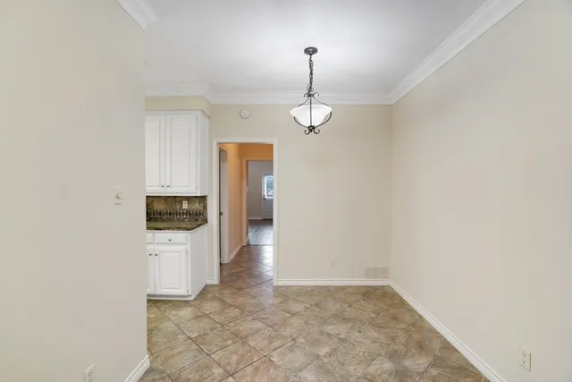 a view of a storage & utility room with a sink