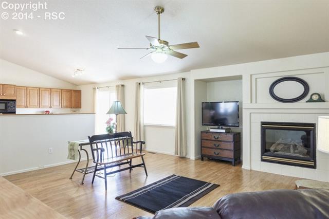 8530 Tibbs Road Peyton, CO 80831 - Photo 5 of 15 Family Room & Kitchen