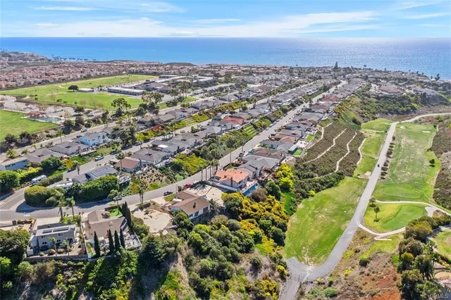 an aerial view of residential building and yard