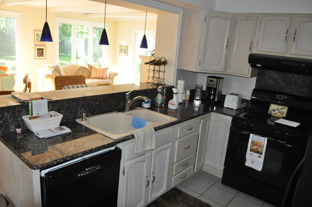 326 Wagner Road Northfield, IL 60093 - Photo 11 of 14 a kitchen with granite countertop a sink a stove and cabinets