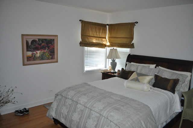 326 Wagner Road Northfield, IL 60093 - Photo 5 of 14 a bedroom with a bed and wooden floor