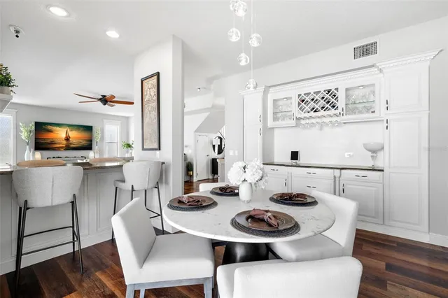 a spacious bedroom with a bed and a television