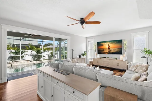a spacious bathroom with a tub a double vanity sink a window and a mirror