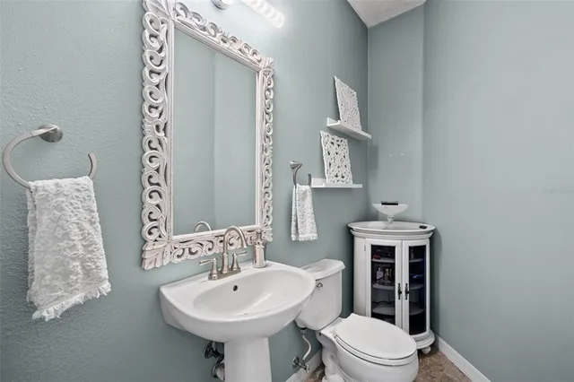 a view of a patio with couches and potted plants