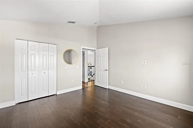 an aerial view of residential houses with outdoor space and ocean view