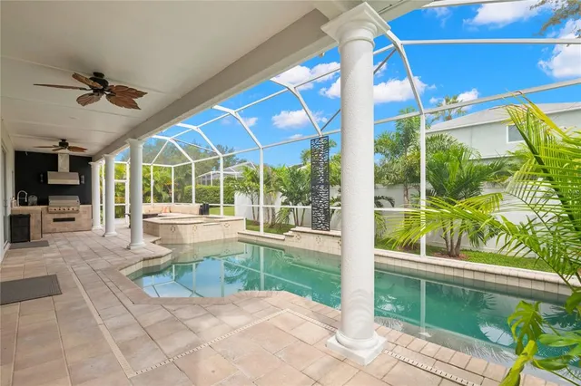 a view of a swimming pool with a patio