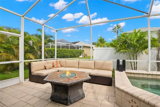 an aerial view of a house with a yard and lake view