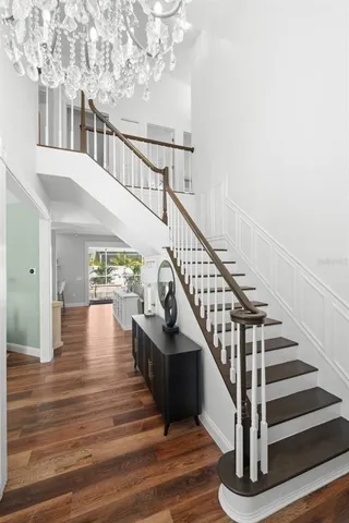 a living room with furniture a rug and a table