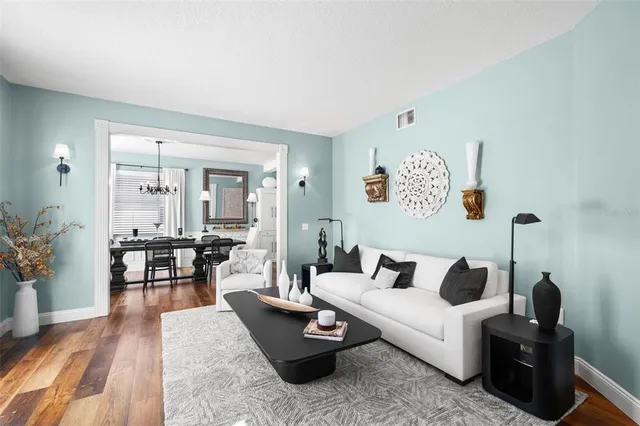 a large kitchen with stainless steel appliances granite countertop a sink a stove and a refrigerator