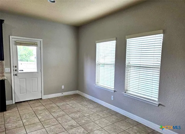 an empty room with windows