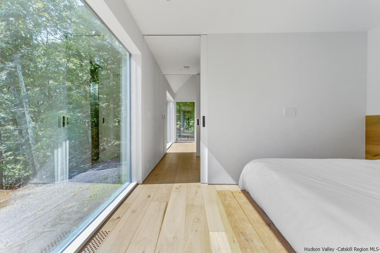 261 Blackhead Mountain Round Top, NY 12473 - Photo 19 of 34 a view of a hallway with wooden floor and staircase