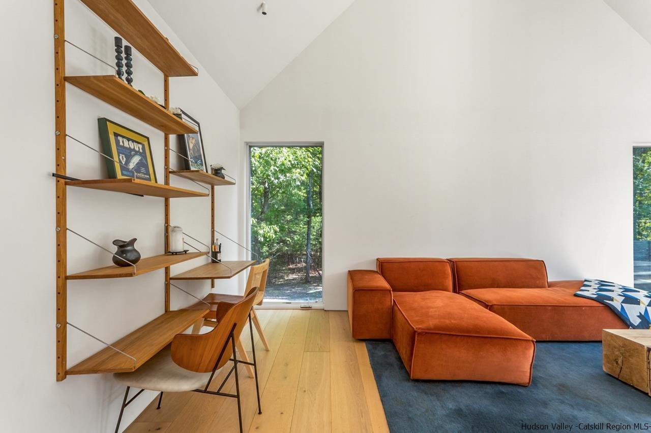 261 Blackhead Mountain Round Top, NY 12473 - Photo 5 of 34 a living room with furniture and a window