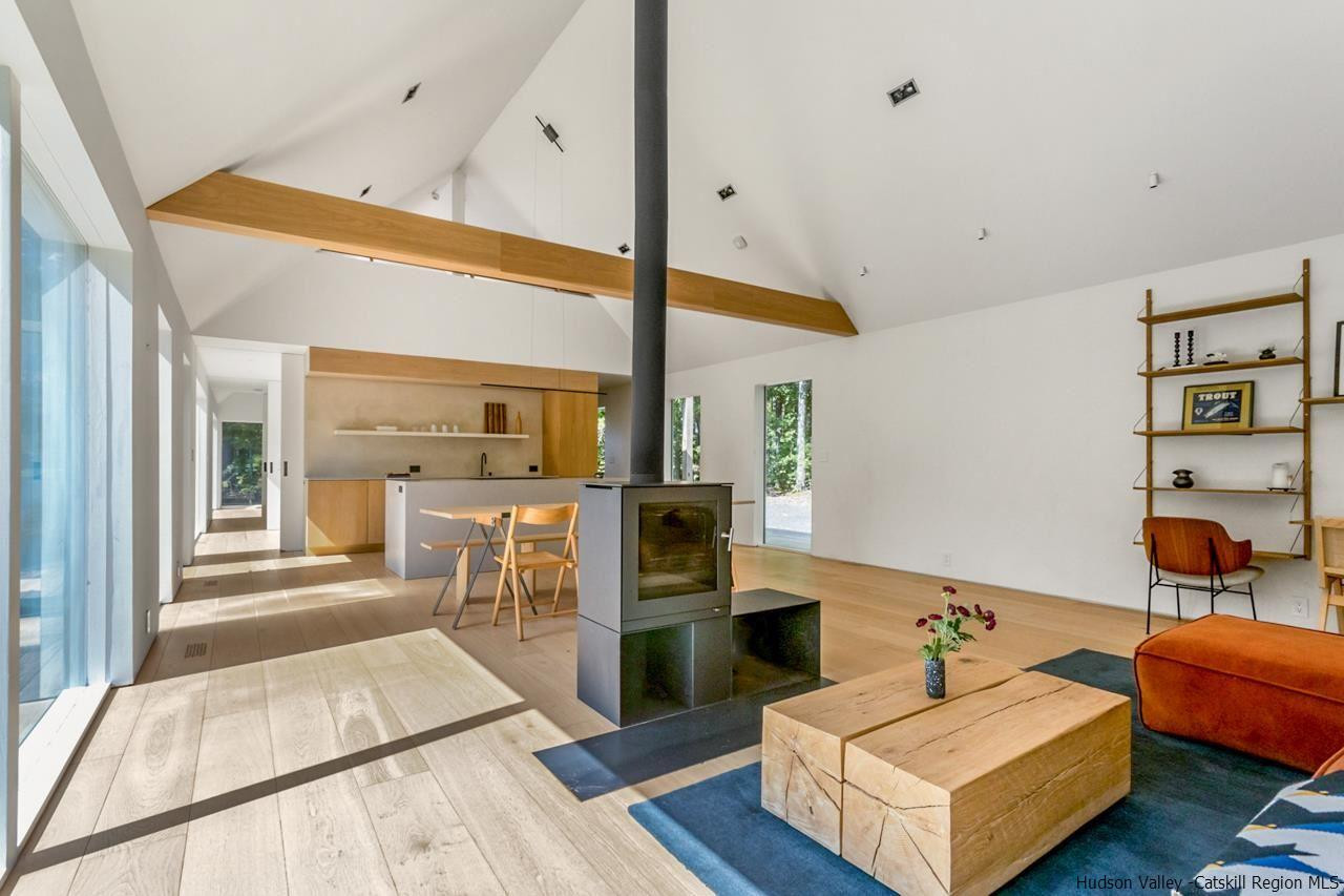 261 Blackhead Mountain Round Top, NY 12473 - Photo 8 of 34 a living room with furniture and a table