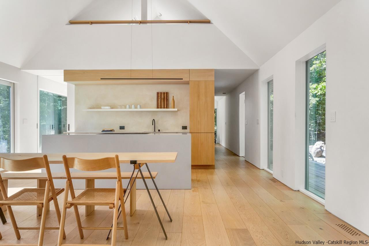 261 Blackhead Mountain Round Top, NY 12473 - Photo 10 of 34 a view of dining room kitchen with furniture and wooden floor