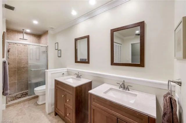 a bathroom with a granite countertop sink mirror and double