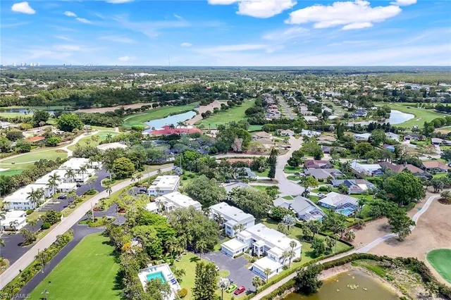 a view of street with small cars parked