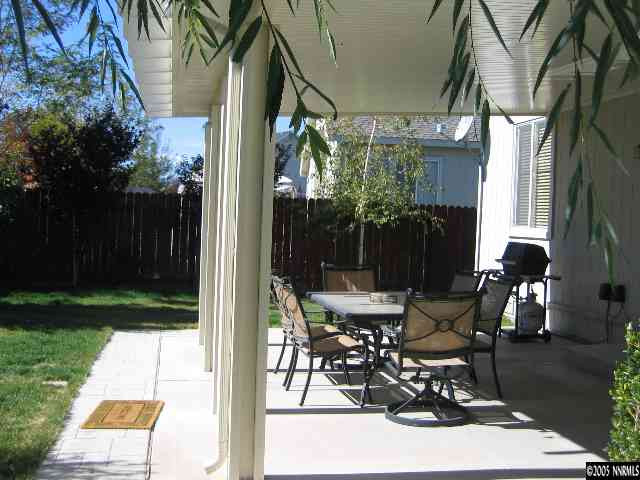 5530 Daybreak Drive Reno, NV 89523 - Photo 8 of 9 a view of a patio with table and chairs and potted plants
