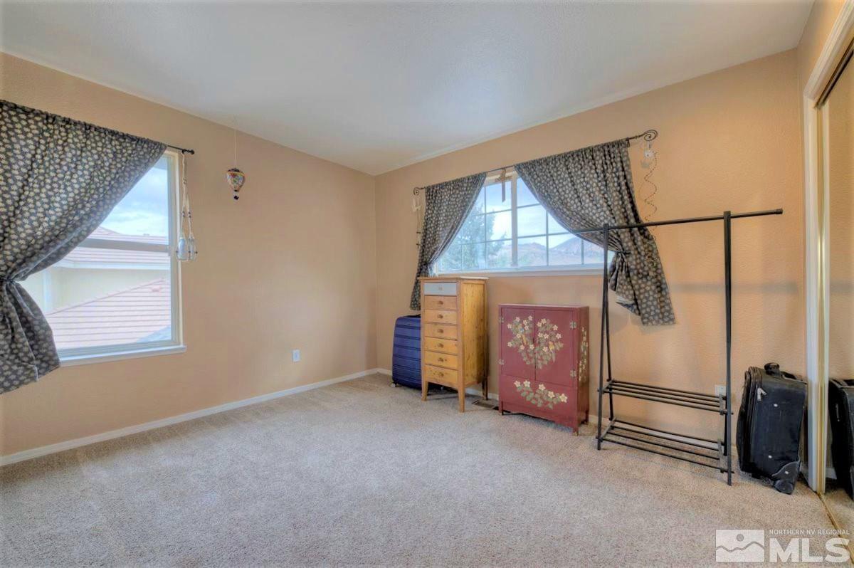 15135 Sylvester Road Reno, NV 89521 - Photo 12 of 34 a view of an empty room with a window