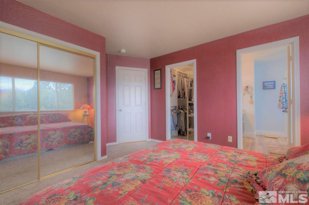 15135 Sylvester Road Reno, NV 89521 - Photo 16 of 34 a bedroom with a bed and a dresser