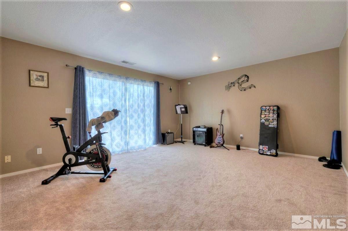 15135 Sylvester Road Reno, NV 89521 - Photo 19 of 34 a view of a room with gym equipment