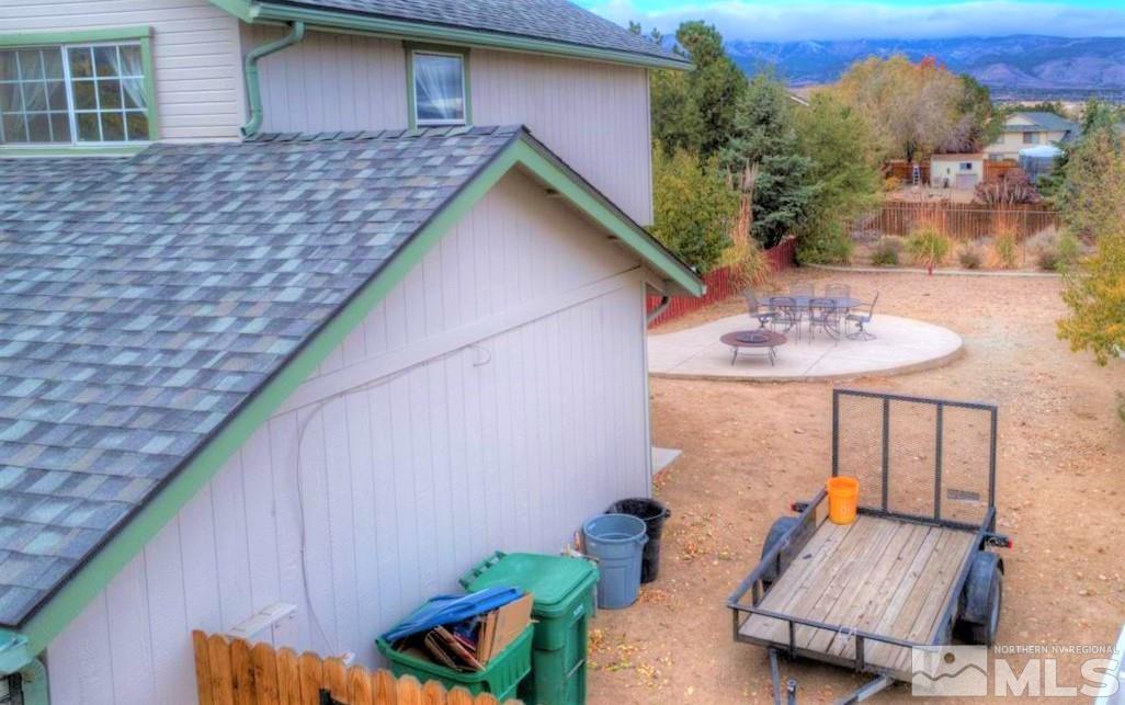 15135 Sylvester Road Reno, NV 89521 - Photo 23 of 34 a backyard of a house with seating space
