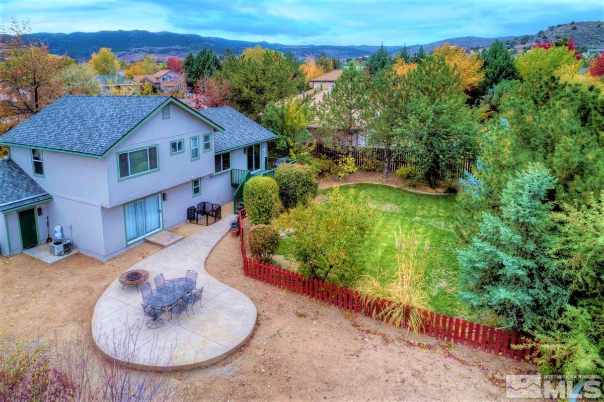 15135 Sylvester Road Reno, NV 89521 - Photo 30 of 34 a view of a house with a yard
