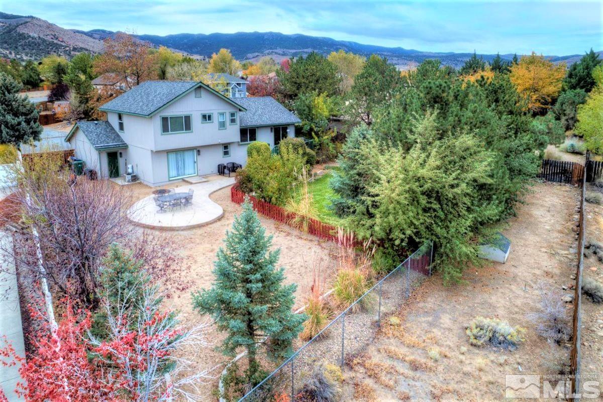 15135 Sylvester Road Reno, NV 89521 - Photo 31 of 34 a view of a house with a yard and garden