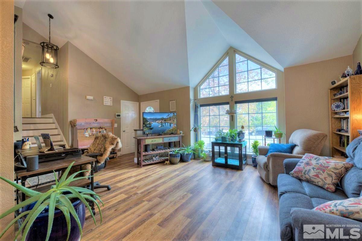 15135 Sylvester Road Reno, NV 89521 - Photo 6 of 34 a living room with furniture and a wooden floor