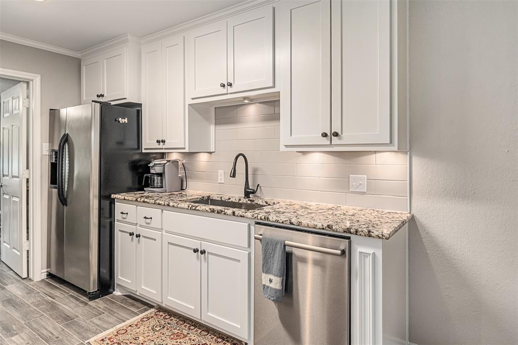1102 Mill Run Road Athens, TX 75751 - Photo 14 of 35 a kitchen with stainless steel appliances granite countertop a sink stove and refrigerator