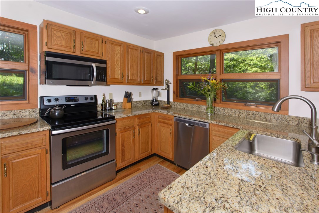 35 Beagle Road Newland, NC 28657 - Photo 5 of 17 a kitchen with a sink stove and microwave