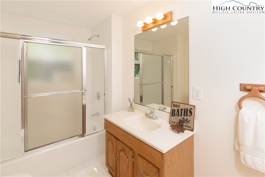 35 Beagle Road Newland, NC 28657 - Photo 8 of 17 a bathroom with a sink vanity and a mirror