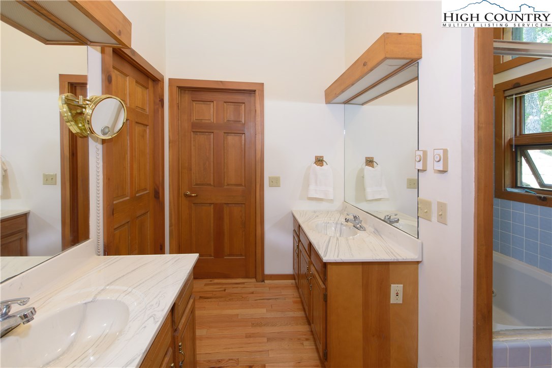 35 Beagle Road Newland, NC 28657 - Photo 9 of 17 a en suite bathroom with a sink and mirror