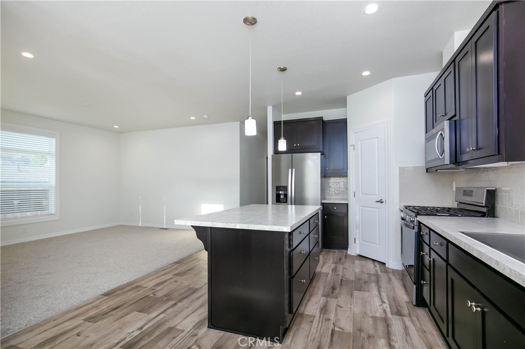 657 Lebec Road, Unit 2 Lebec, CA 93243 - Photo 11 of 17 a kitchen with a sink a refrigerator and wooden floor
