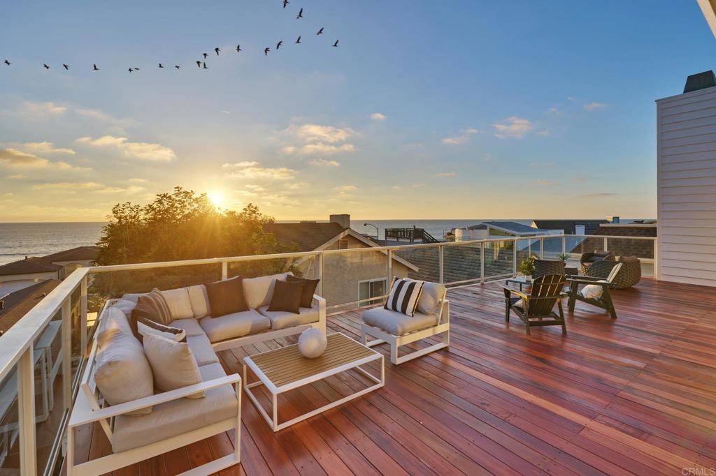 wooden roof deck with furniture