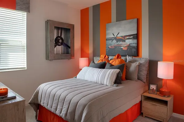 a bedroom with a bed and window