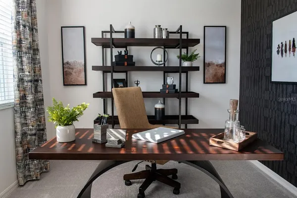 a view of a workspace with furniture