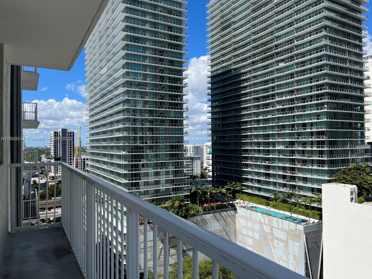 1250 South Miami Avenue, Unit 1414 Miami, FL 33130 - Photo 13 of 25 a view of a balcony with wooden floor