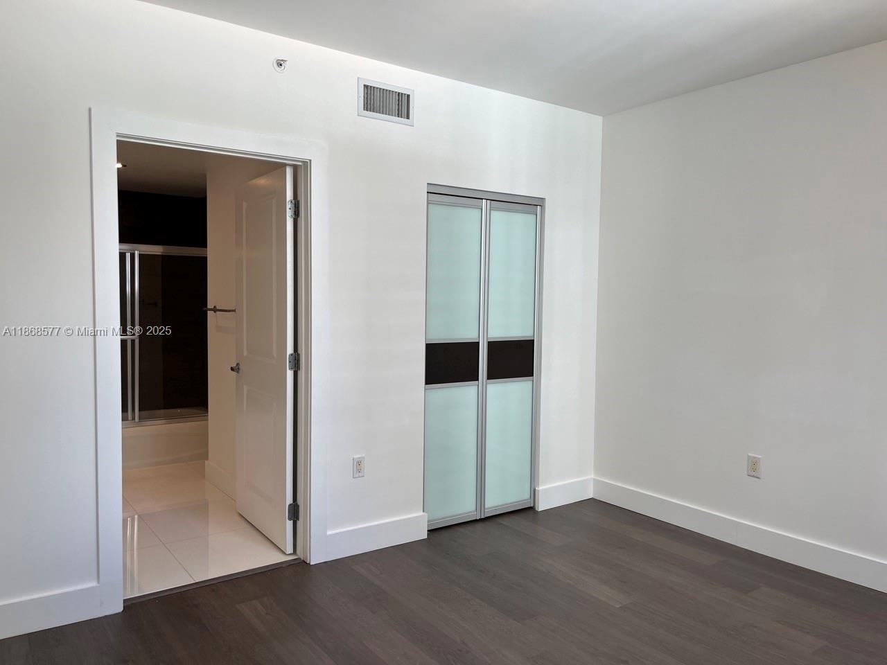 1250 South Miami Avenue, Unit 1414 Miami, FL 33130 - Photo 15 of 25 an empty room with wooden floor
