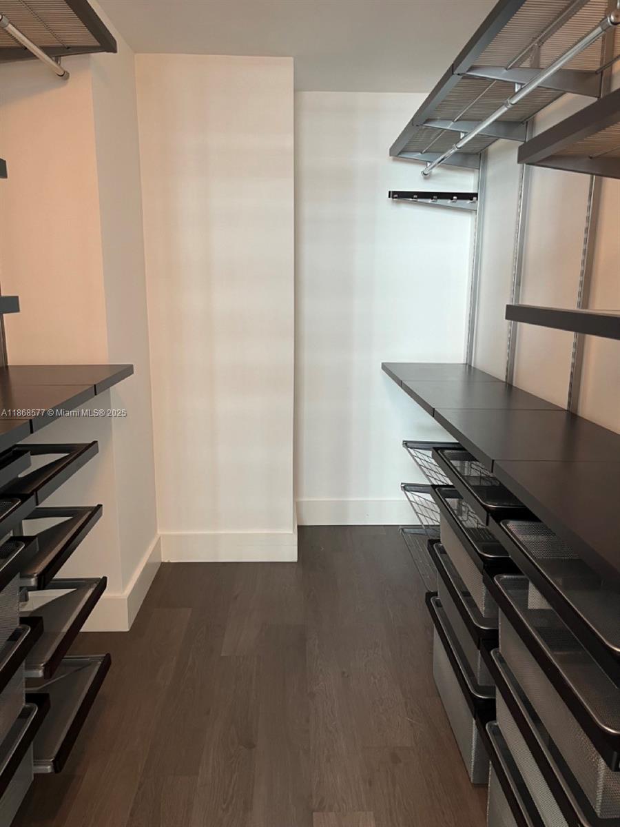 1250 South Miami Avenue, Unit 1414 Miami, FL 33130 - Photo 17 of 25 a view of an empty room with wooden floor