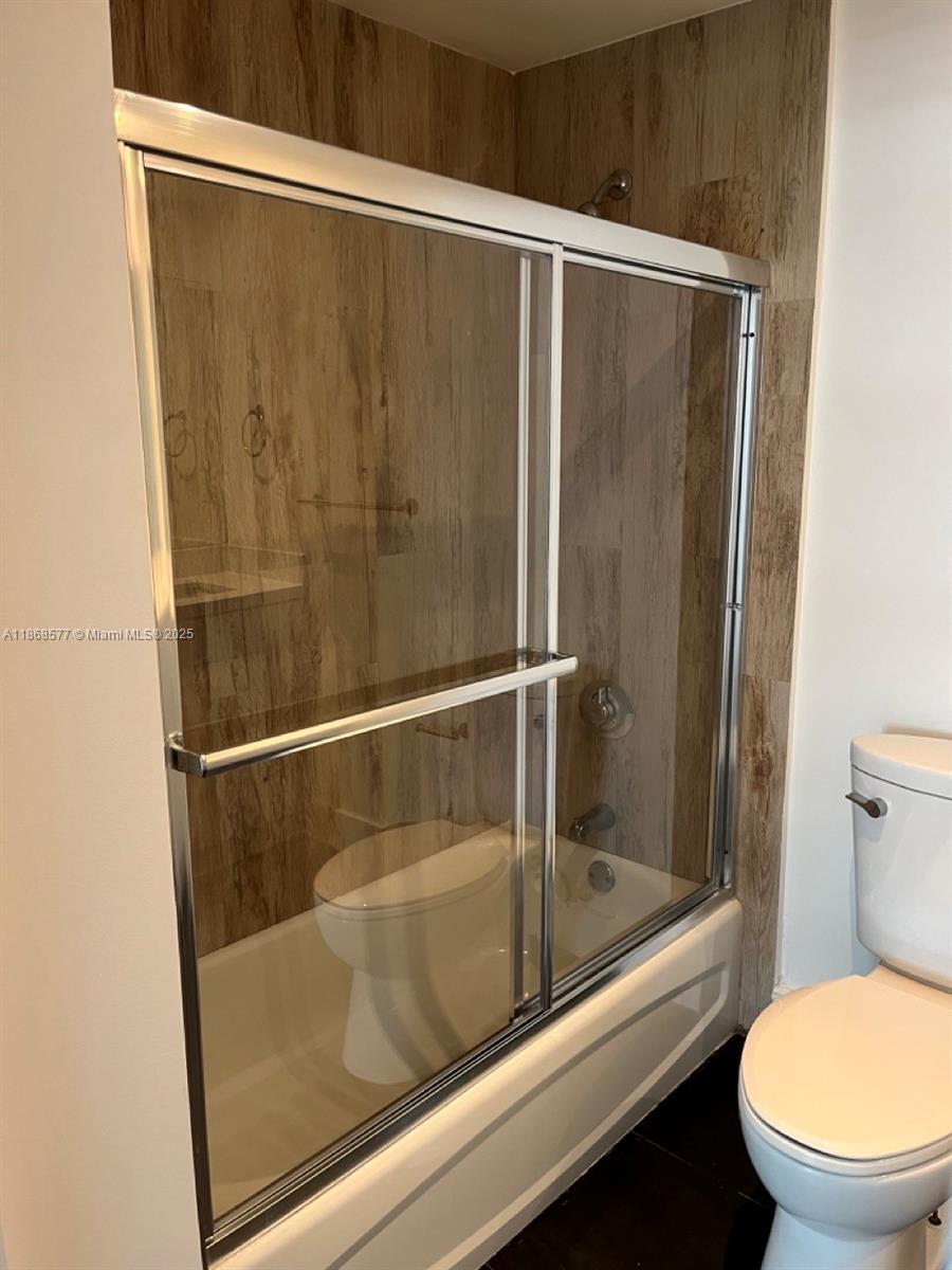 1250 South Miami Avenue, Unit 1414 Miami, FL 33130 - Photo 18 of 25 a bathroom with a shower and toilet
