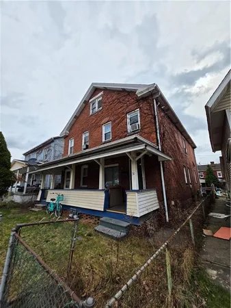 a view of a house with a small yard