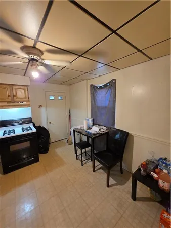 a living room with furniture and a piano